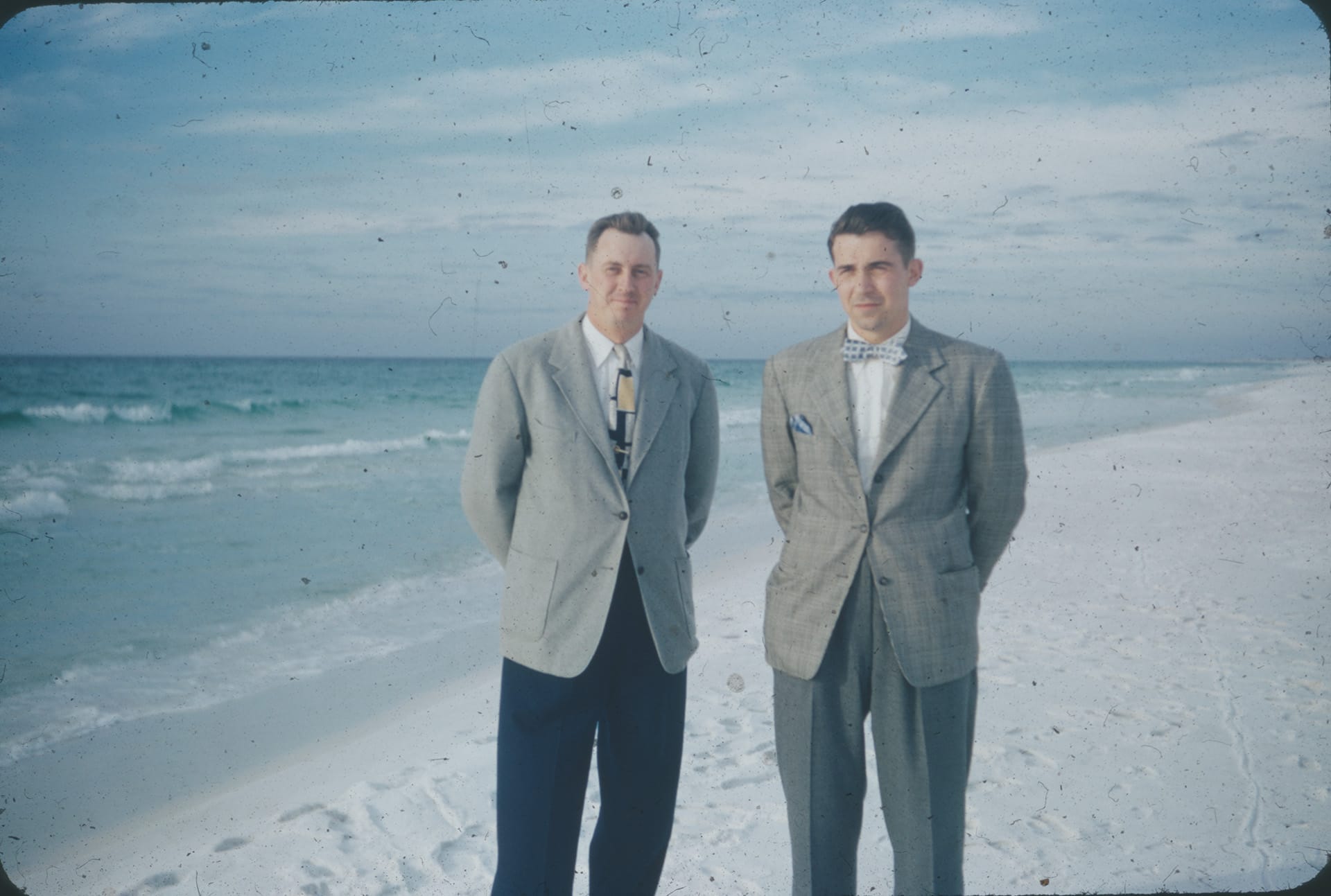 Men In Suits At The Beach